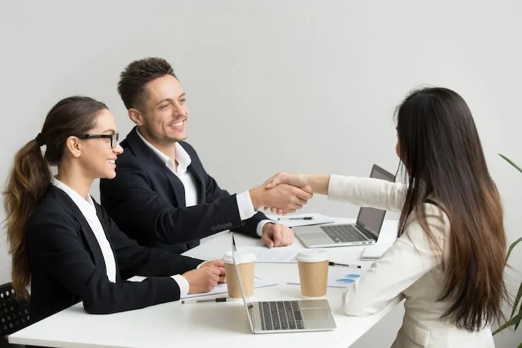 friendly-partners-handshaking-group-meeting-thanking-successful-teamwork_1163-4691.jpg?semt=ais_hybrid&w=740&q=80