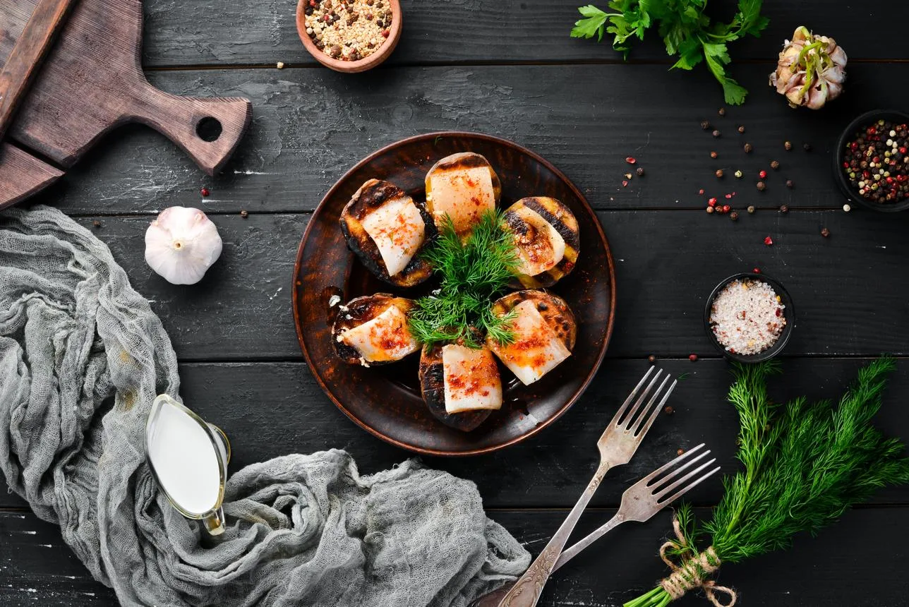 Potatoes fried with lard and garlic. Ukrainian Traditional Cuisine. Top view. Free space for your text. Rustic style.